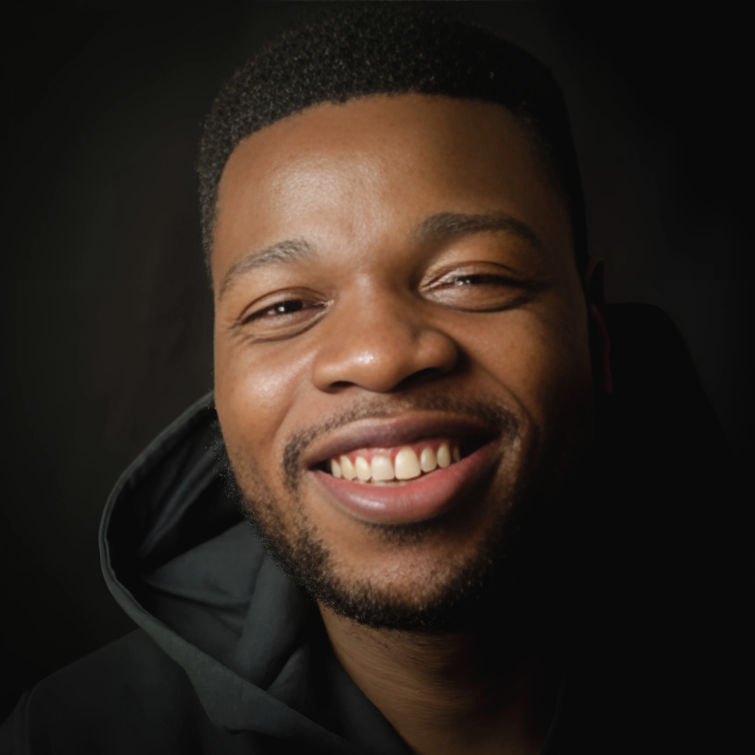A professional headshot of Oluwatosin Raji